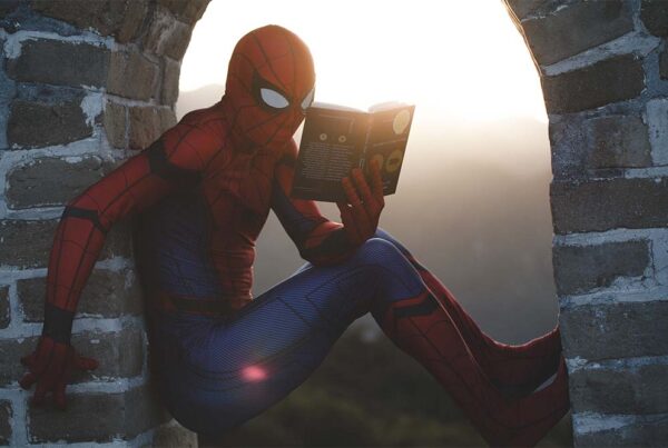 spiderman reading a book