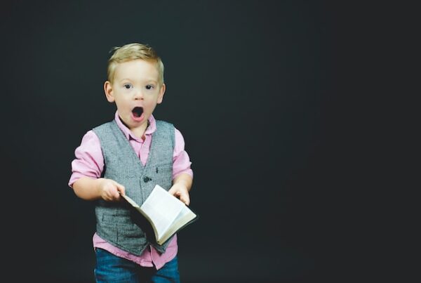 Shocked boy opening the Bible