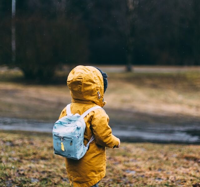Toddler in a yellow rain coat